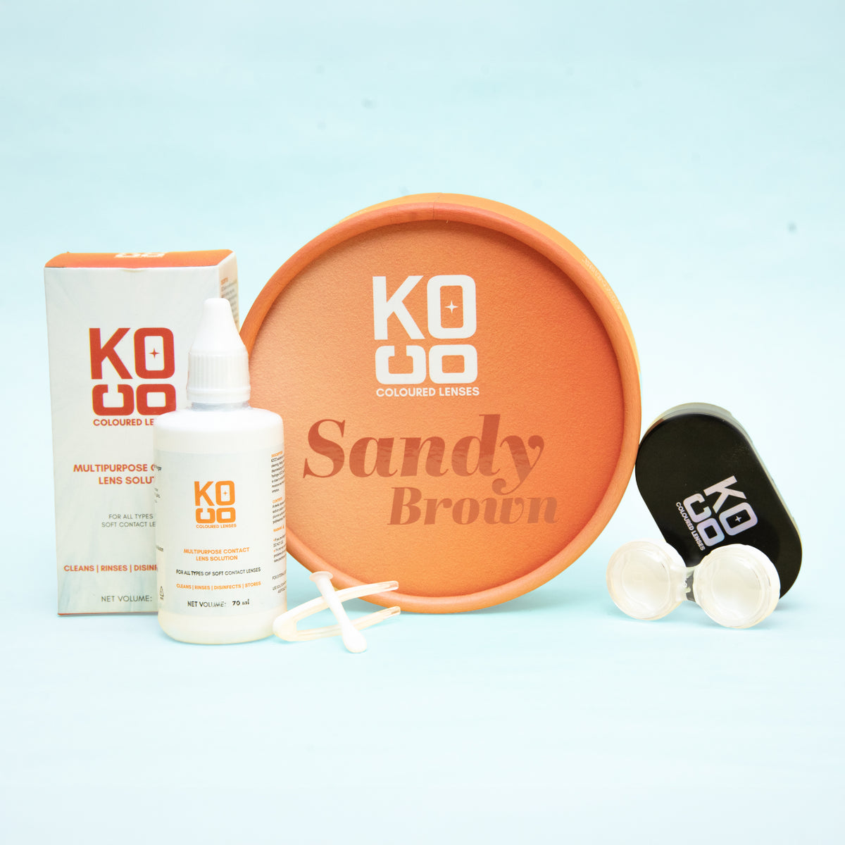 Koco Lenses Sandy Brown colored contact lens with lens solution, case, and accessories